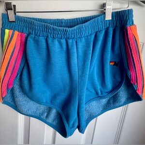 Aviator Nation neon blue rainbow stripe jogger shorts AV logo new